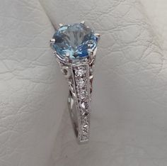 "We designed and handmade this ring. The center is a beautiful Aquamarine .96 Cts / 6.5mm . The Aquamarine is absolutely stunning. With six side diamonds .13 Cts. It is made in 18k white gold. We can make it any size from 5-7 and you still be able to return it within the listed time frame. Sizing outside of that range requires a resize fee if for any reason the ring is retuned. Ring sizing may add additional handling time. We love this ring because it represents the way jewelry should be made wi Antique Engagement Rings Vintage, Van Nuys, Engagement Ring Vintage, Diamond Engagement Rings Vintage, Aquamarine Blue, Ring Vintage, Antique Style, Aquamarine, Sapphire Ring