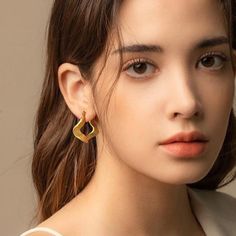 Dive into the world of modern art with Wavy Hoops, elegantly crafted in 18k gold plating. These unique earrings feature an intriguing wavy design, offering a chic and contemporary look. Modern Gold Plated Pierced Earrings, Modern Gold Plated Earrings, Modern Gold Plated Drop Earrings, Modern Gold Plated Wrap Earrings, Modern Tarnish Resistant Drop Wrap Earrings, Modern Tarnish-resistant Drop Wrap Earrings, Modern Gold Wrap Earrings For Pierced Ears, Modern Twist Tarnish Resistant Earrings For Gifts, Modern Twist Tarnish-resistant Earrings As Gift