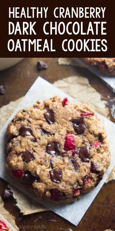 healthy cranberry dark chocolate oatmeal cookies on top of parchment paper