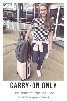 a woman standing next to her luggage with the words carry - on only