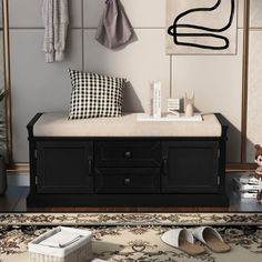 a black and white bench sitting on top of a rug