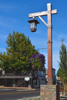 a large wooden cross on the side of a road