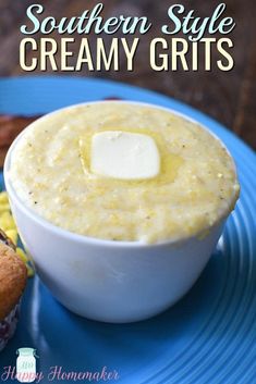 a bowl of creamy grits on a blue plate next to muffins