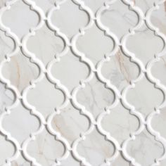 Recycled glass arabesque mosaic tile with matte finish. Stunning marble stone looks design wall tile. Perfect on shower floor, kitchen backsplash, bathroom wall and more. Grade 1, first-quality recycled glass tile for floor and wall use. Completely frost resistant for indoor or outdoor applications. Class 3 abrasion resistance - suitable for floor applications with medium to heavy foot traffic. Vitreous tile has water absorption of less than 0.5%. Don't forget your coordinating trim pieces, grou Arabesque Tile Shower Wall, Arabesque Shower Tile Ideas, How To Make Ceramic Tiles, Arabesque Tile Shower, White Tile Bathroom Floor, French Country Tile, Arabesque Tile Backsplash, Backsplash Arabesque, Backsplash Bathroom Wall