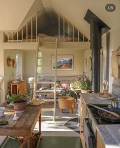 a kitchen and living room are separated by a lofted area with an open floor plan