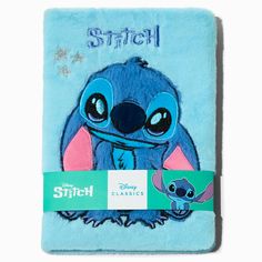 a blue towel with stitch on it and an image of the character stitch from disney's