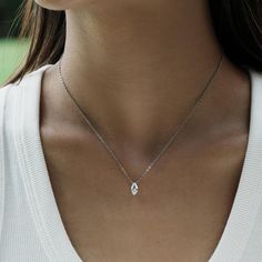 Marquise Cut Solitaire Pendant Necklace for Women. This 14k Gold Necklace features a stunning Marquise Cut Moissanite & Lab Grown Diamond, available in various chain lengths for any outfit. Perfect bridal jewelry or everyday wear. 💍Centre Stone and Material💍 💎Centre Stone Options💎 Moissanite (Lab-grown ethically similar diamonds) Cut: Marquise, 2EX Weight: 0.5ct Colour: D Clarity: VVS1 Lab Grown Diamond (Lab-grown ethical and genuine diamonds) Cut: Marquise, 2EX Weight: 0.5ct Colour: D-E Clarity: VS1 Certificate: Free IGI certificate included Stone Size: Size: 0.5ct: 8.2 x 4.2 MM Quantity: 1 📏Band Details📏 Metal Available: Silver Plated Wihte Gold (Rhodium)Silver Plated Yellow Gold (14k Gold) 10K Solid Gold, 14K Solid Gold, 18K Solid Gold Colour Options: White(W), Yellow(Y), Rose(R) Marquise Diamond Necklace Pendants, Bridal Jewelry Diamond, Gold Bridal Jewelry, Moissanite Pendant, Solitaire Pendant Necklace, 14k Gold Necklace, Solitaire Pendant, Jewelry Diamond, Marquise Diamond