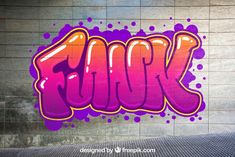 graffiti on the side of a building with purple and orange spray paint