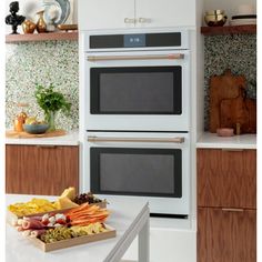 two ovens side by side in a kitchen