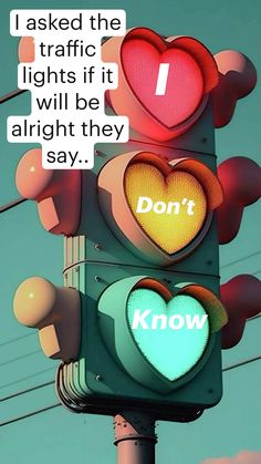 a traffic light with two hearts on it that says i asked the traffic lights if it will be alright they say