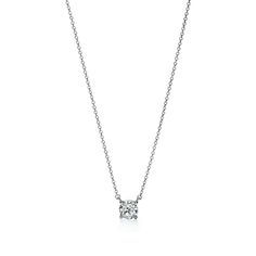 Legendary diamonds of superlative cut, color, clarity and brilliance. Pendant in platinum with a round brilliant diamond. On a 16" chain. Round brilliant diamond, carat weight .78, color grade F, clarity grade VS1 | Tiffany Solitaire Diamond Pendant in Platinum Tiffany Solitaire, Solitaire Diamond Pendant, Solitaire Necklaces, Tiffany & Co., Diamond Pendant, Platinum, Silver Necklace, Jewelry Necklace Pendant, Jewelry Necklaces