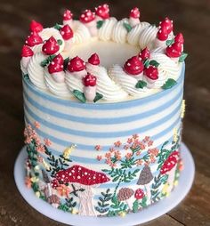 a decorated cake sitting on top of a wooden table