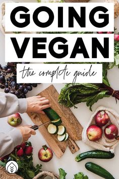 a person cutting vegetables on a cutting board with the title going vegan, the complete guide