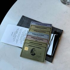 three credit cards sitting on top of a table