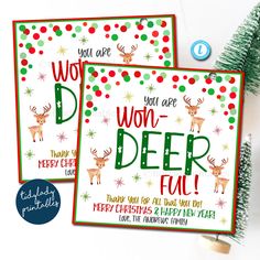 two christmas cards with reindeers and snowflakes on them, next to a tree