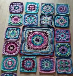 crocheted squares are arranged on a table