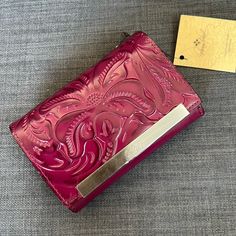 Brand New With Tag Wallet Case Organizer Style: P143244 Tooled Genuine Leather Florence Design Magenta Color Antique Brass Hardware Deep Embossed Logo Heavy Handcrafted Stiching Exterior: Flap With Snap Closure Interior: Two Currency Compartments One Id Window One Zipper Compartment Twelve Credit Card Slots Three Slip Compartments Approximately 6"L 4”H 2"W Durable Elegance Made In Italy Pet & Smoke Free Home Please See My Entire Collection Blue Leather Wallet, Brown Leather Wallet, Leather Floral, Rfid Wallet, Leather Frames, Antique Brass Hardware, Fashion Organization, Credit Card Wallet, Coin Bag