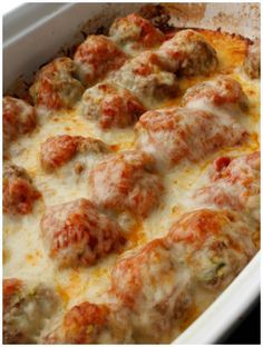 a casserole dish with meatballs and cheese in it, ready to be eaten