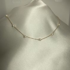 Freshwater "Potato" shape ivory pearls necklace , 5x7 mm.  Carefully spaced, 7 pearls, wire wrapped with 14K gold filled wire and using all 14K gold filled chain and findings.  I use either a 14K gold filled cable chain or a sterling silver cable chain.  It is 17" long with a spring clasp and soldered jump ring closure. See choice of length in Variations. This is a classic style that is great alone or as a layering piece.  The quality of these pearls is essential to the stylish look. I also offe Delicate Chain Pearl Necklace With Round Beads, Delicate Chain Pearl Necklace, Pearl White Necklace With Delicate Chain, Classic Pearl Necklace With Adjustable Chain, Cream Pearl Drop Necklace As Gift, Cream Pearl Drop Necklace Gift, Cream Pearl Drop Necklace For Gift, Cream Pearl Pendant Necklace, Classic Cream Necklace With Pearl Chain