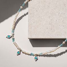 Give the gift of love with the Mughal Love Necklace. Delicate real gemstones of Pearl and Apatite cleverly combine with 3 delicate Moorish inspired silver charms, a Turquoise stone in the centre of each, creating this elegant adjustable necklace. Mexican and Moroccan influences in the charms hint at Charlotte's foreign travels.  Handmade Sterling silver, Pearl & faceted Apatite All of our stones are real so colours may vary Handmade jewellery made from sterling silver, brass, bronze, and mixed m Elegant Apatite Necklace As Gift, Elegant Apatite Necklace For Gifts, Elegant Apatite Jewelry With Birthstone, Elegant Apatite Birthstone Jewelry, Silver Beaded Necklace, Charlotte's Web, August Birthstone Jewelry, Silver Bead Necklace, July Birthstone Jewelry