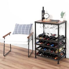 a wine rack with many bottles and glasses on it in front of a white chair