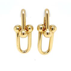 PRODUCT DESCRIPTION: 14k Large Link Gold Earrings / Thick Hoop Earrings / Dangle Huggie Earrings / Paperclip Hoops / Chunky Gold Link Earrings / Gift for Her - Gold Purity: 14k Semi-Hollow Gold  - Gold Weight: 8.5 Grams Comes in: 14k Yellow Gold  Earring Dimensions: (35mm Height Total Hanging) x (24mm Height Per Link) x (13mm Width)      ------------------------------------------------------------------------------------------------------------------------------------------ All Items Are Brand New!   Includes Free Gift Box and Free Shipping!   PLEASE BE ADVISED THAT ITEMS ARE IN STOCK 95% OF THE TIME. IF YOU PURCHASE AND IT IS NOT IN STOCK, WE WILL REFUND YOU IMMEDIATELY.    All of our items are 100% genuine.   We are an established Family Business, working in the Diamond District in Manha Modern Clip-on Dangle Earrings, Gold Single Paperclip Earring, Gold Paperclip Shape Single Earring, Gold Paperclip Shaped Single Earring, Modern Clip-on Huggie Earrings, Modern Clip-on Dangle Hoop Earrings, Gold-plated Chain Link Earrings, Vintage Gold Clip-on Hoop Earrings, Gold-tone Clip-on Hoop Earrings In Brass