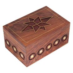 a wooden box with four holes in it