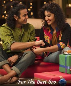 a man and woman sitting on a couch with presents in front of them for the best brochure