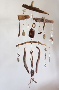 an image of a mobile phone with shells and seashells hanging from the ceiling