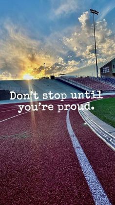 an empty track with the words don't stop until you're proud