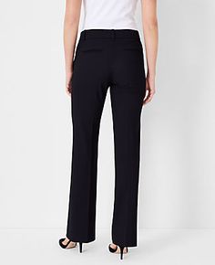 Elevate your wardrobe with the Ann Taylor Trouser Pant in Seasonless Stretch - Curvy Fit. Tailored to flatter with a curvy silhouette, these pants are a must-have for any fashion-forward professional. The design features a mid-rise waist, sitting comfortably below the natural waistline, and a subtly flared leg that elegantly lengthens your legs. Perfect for year-round wear, the fabric blend of 68% polyester, 29% viscose, and 3% spandex ensures durability and stretch for all-day comfort.

- **Col Classic Stretch Bottoms With Straight Silhouette, Elegant Mid-rise Business Bottoms, Elegant Mid-rise Bottoms For Business, Sleek 4-way Stretch Pants For Workwear, Elegant Stretch Straight Leg Bottoms, Elegant Stretch Straight Silhouette Bottoms, Elegant Stretch Bottoms With Straight Silhouette, Elegant Stretch Straight Bottoms, Elegant Mid-rise Slim Fit Pants