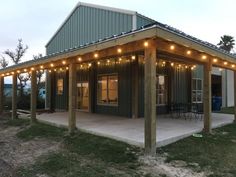 a covered patio with string lights on it