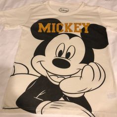 a mickey mouse t - shirt with the word mickey on it