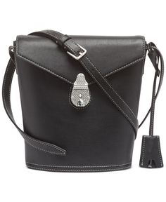 A casual-cool silhouette with statement hardware. Calvin Klein's leather bucket bag is the perfect way to showcase refined, everyday style.
<ul class="">
 	<li>Mini sized bag; 7"W x 10"H x 3"D (width is measured across the bottom of handbag); 1 lbs. approx. weight</li>
 	<li>17"L adjustable strap</li>
 	<li>Lock closure</li>
 	<li>Silver-tone exterior hardware &amp; 1 zip pocket</li>
 	<li>1 interior zi Calvin Klein Leather Shoulder Bag With Adjustable Strap, Workwear Bags With Gold-tone Hardware And Bucket Shape, Bucket Bag With Gold-tone Hardware For Work, Black Leather Bucket Bag With Gold-tone Hardware For Work, Modern Bucket-shaped Bags With Metal Hardware, Modern Bucket Bags With Metal Hardware, Modern Bucket Shape Bags With Metal Hardware, Trendy Evening Bucket Bag With Metal Hardware, Bucket Bag With Metal Hardware