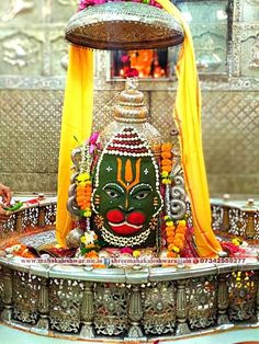 an idol is displayed in front of the altar