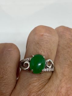 Vintage green nephrite jade Ornate German Silver ring, does not tarnish, NOT sterling Sizes 7, 8 or 9 All rings are shipped in a nice gift box. Check out our over a THOUSAND great reviews Engraving is $4 per letter and is not always perfect depending on the piece. It can take a few days if the jeweler is busy. This is payable to Paypal Judithsltd@gmail.com Green Jade Ring Suitable For Gift, Green Jade Ring As A Gift, Green Jade Jewelry For Promise Ring, Green Jade Ring For Gift, Green Jade Jewelry For Anniversary, Green Jade Promise Ring, Green Jade Rings For Promise, Green Oval Jade Ring, Green Jade Anniversary Rings