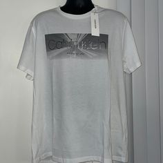 Color: White Size:M , X-L Calvin Klein White Logo Print T-shirt, Calvin Klein White Relaxed Fit T-shirt, White Calvin Klein Crew Neck T-shirt, Calvin Klein White Crew Neck T-shirt, White Calvin Klein Cotton T-shirt, White Cotton Calvin Klein T-shirt, Calvin Klein White Short Sleeve Top, Calvin Klein Graphic Tee For Spring, White Calvin Klein T-shirt For Spring