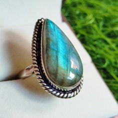 Natural Multi Fire Labradorite Ring, Handmade Brass Ring, Unisex Ring, Adjustable Ring, Beautiful Multi Labradorite Pear Shape Ring, ❀ Stone : Labradorite ❀ Stone Size: 25x 13 mm approx ❀ Ring Size: Adjustable Ring ❀ Metal : brass ❀ Quantity: 1 Piece ❀ Ring Weight : 48.00 Carat It's a perfect gift for mom, daughters, sisters, wife, bridesmaids, girlfriends, your best friend, and yourself. It's handmade with love for all occasions, such as wedding, anniversary, birthday, Mother's day, Valentine's Pear Shape Ring, Pear Shaped Ring, Handmade Brass, Labradorite Ring, Unisex Ring, Brass Ring, Labradorite Stone, Perfect Gift For Mom, Ring Handmade