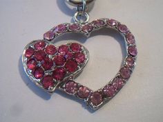 Pink double heart necklace. It measures approx. 19 inches and has a toggle clasp closure. Made with a light pink rhinestone heart silhouette and a smaller solid hot pink rhinestone heart. Silver tone. Perfect for give or wear on Valentine's Day. All sales are final and as is. Thank you for looking. You may also love this: https://www.etsy.com/listing/584789387/heart-silhouette-pendant-necklace?ref=shop_home_active_1 Valentines Day Costume, Pink Heart Pendant, Heart Silhouette, Double Heart Necklace, Carnelian Ring, Rhinestone Heart, Double Heart, Lovely Necklace, Lovely Earrings