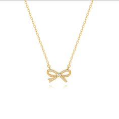 NECK JEWELRY: Featuring a 20mm long * 12mm wide cubic zirconia pave bow pendant, the simple everyday necklace is minimal and lightweight. This CZ bowtie charm necklace sparkles in the light and is very beautiful.The total length of the bow necklace is 16"~18", so you can adjust it to fit your neck size or layer it with other gold chokers for women.  TRENDY JEWELRY: The sweet cute necklace is designed with the most fashionable element of the moment - a bow. The bohemian necklace is simple and is easy to match clothes. Adopting 18k gold plated material, the gold bow choker will not fade easily. CHIC JEWELRY: The bowknot pendant necklace is handcrafted by skilled workers. The cubic zirconia bow necklace ensures that the cubic zirconias are firmly fixed on the pendant by using advanced micro-i Simple Necklace Everyday, Gold Chokers, Bow Choker, Layering Jewelry, Bow Pendant, Neck Jewelry, Gold Chain Choker, 18k Gold Chain, 18k Gold Necklace