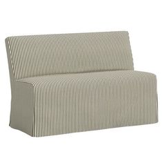 a striped couch sitting on top of a white floor