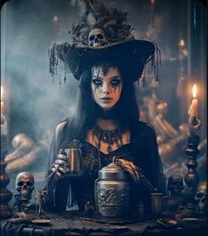 a woman dressed as a witch with skulls and candles in front of her, holding a teapot