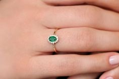 "Emerald Ring / 14k Classic Oval Cut Emerald Ring with Surrounding Diamonds / Natural Emerald Ring in 14k Solid Gold / Mothers Day Gift * If you would like to see the Matching Earrings Please Click Below https://www.etsy.com/listing/604292239/emerald-earrings-14k-oval-cut-emerald?ref=related-4 * If you would like to see the Matching Necklace Please click Below https://www.etsy.com/listing/590436480/emerald-necklace-14k-classic-oval-cut?ref=related-1 Item Features * Made to Order. * Gold KT: 14K 14k Yellow Gold Cluster Ring With Oval Shape, Elegant Cluster Birthstone Rings, Oval Yellow Gold Emerald Ring With Halo, Elegant Birthstone Cluster Rings, Dainty Oval Diamond Ring In 14k Gold, Dainty Oval Cluster Ring In 14k Gold, 14k Gold Halo Ring With Oval Shape, Dainty 14k Gold Oval Cluster Ring, Oval Emerald Ring In Yellow Gold With Halo Setting