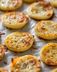 baked potato chips with cheese and seasoning on a baking sheet, ready to be eaten