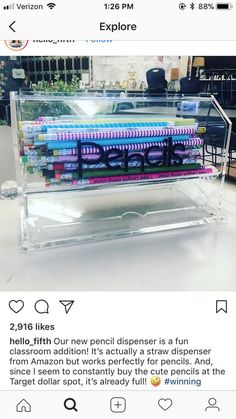 a display case filled with lots of different colored items on top of a white table