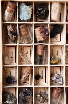 a box filled with lots of different types of rocks and crystals on top of each other