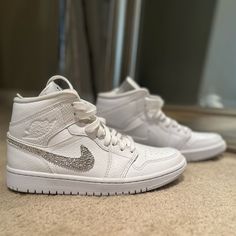 Custom Mid Jordan 1’s With Beautiful Crystals On The Nike Swoop. Great For Bride During Or After Ceremony, Wedding Party, Bachelorette Or Any Time You Need Some Extra Bling! Going For Much More On Sites Like Etsy! Quinceanera Shoes Sneakers, Quinceanera Shoes, Mid Jordan 1, Beautiful Crystals, Jordan 1s, Party Bachelorette, Ceremony Wedding, Womens Jordans, Jordan Shoes