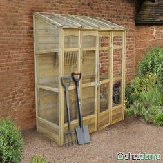 a garden shed with gardening tools in it