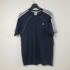 Adidas Climalite Mens Athletic Shirt Large Navy Pullover Short Sleeve Crewneck. Staining present. No rips or pulls. Previous washings may impact manufacturer sizing Measurements are included in photos. Measurements are approximate. It is recommended to compare to a similar garment that you own and fits you well. Keep in mind that we offer 30-day free returns.  If you are interested in multiple items let us know and we can combine shipping. We ship out items everyday! Please let us know if you ha Blue Sports Top With Three Stripes Branding, Blue Sports Tops With Three Stripes Branding, Adidas Navy Sports Top, Blue Adidas Sportswear T-shirt, Blue Adidas Tops For Sports Season, Navy Sports Top With Three Stripes, Navy Sports Tops With Three Stripes, Adidas T Shirt Outfit, Adidas Shirt Mens