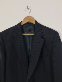 "-Description- >Stafford men's black pinstriped sport coat >two button front >four buttons on the cuffs >one open and two flap close pockets on the front >vent in the back >partially lined >size 44L >so classy! >condition: very good >color(s): black >fabric(s): wool >brand: stafford >care: dry clean -Measurements- >size: 44L ✩ all measurements are taken with the item laying flat & some sizes are estimates so please check measurements ✩ chest: 46\" / Pinstripe Single Breasted Sport Coat For Semi-formal, Semi-formal Pinstripe Single Breasted Sport Coat, Classic Pinstripe Outerwear For Business, Tailored Pinstripe Sport Coat For Business, Business Striped Sport Coat With Welt Pockets, Striped Sport Coat With Welt Pockets For Business, Fitted Striped Sport Coat For Business Casual, Tailored Pinstripe Sport Coat Single Breasted, Classic Formal Outerwear With Vertical Stripes